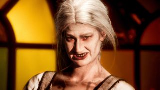 an undead woman with white grey hair and ghastly skin in a still from dead lover