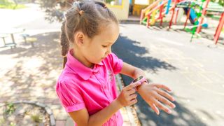 Girl looking at smartwatch on her wrist