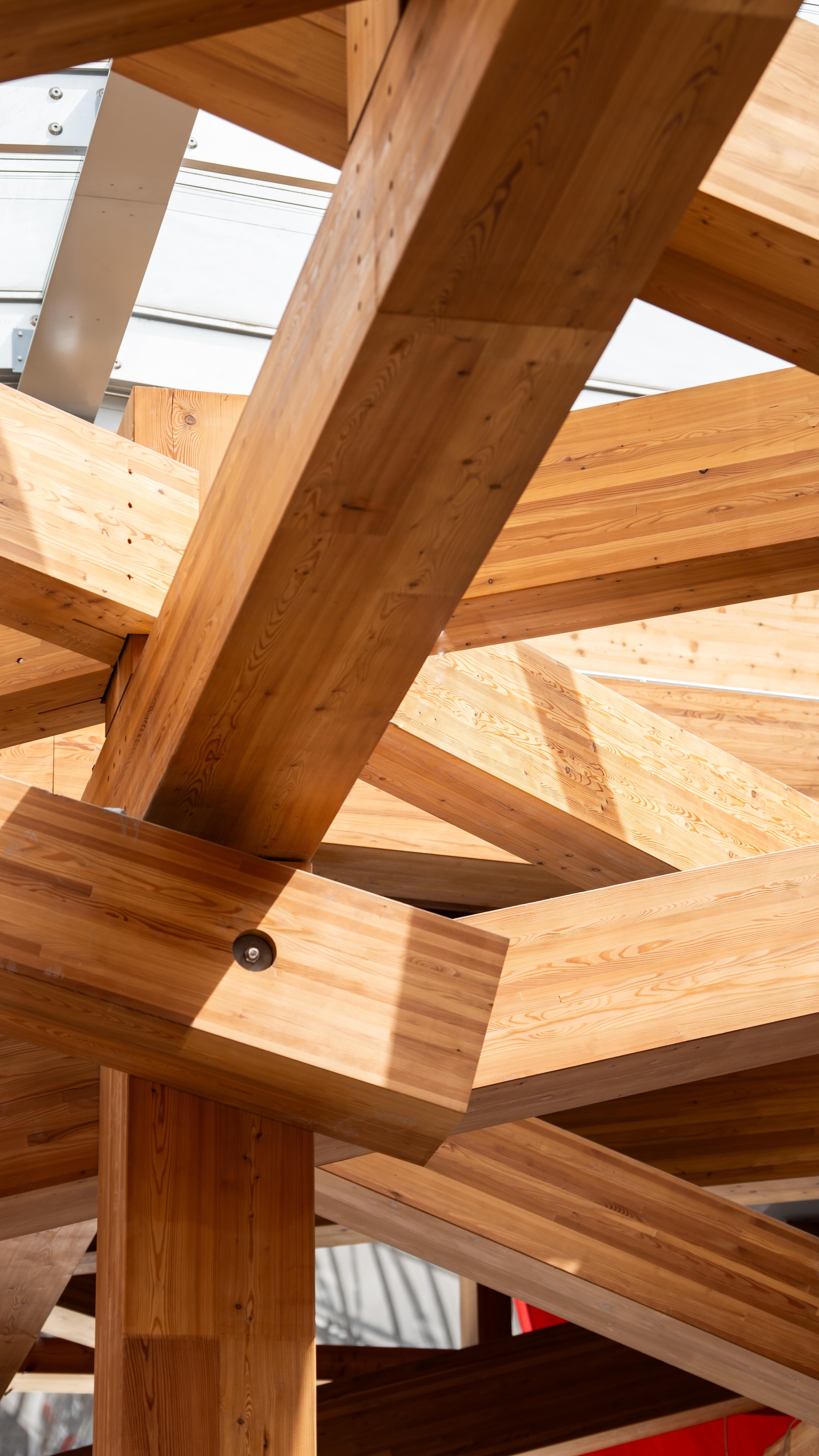Guggenheim Abu Dhabi exterior images featuring a geometric assemblage of volumes made from steel glass timber and stone