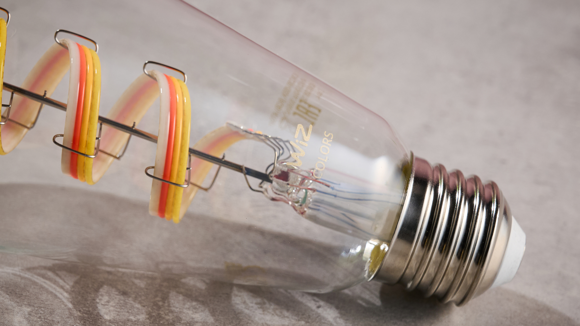 A close-up of the WiZ filament bulb's fitting.