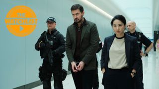 Dr. Nolan (Richard Armitage) in handcuffs being walked down a corridor by police, including DC Hana Li (Jing Lusi) in ITV's Red Eye, with our orange Watchlist badge in the top-left corner of the image