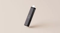 Amazon Fire TV Stick 4K on a cream background