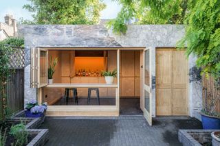 marble clad garden room with home bar