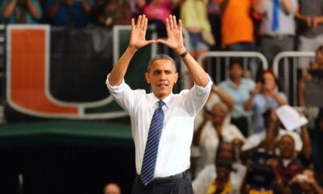 President Obama creates a &amp;quot;U&amp;quot; with his hands before speaking at the University of Miami on Oct. 11.