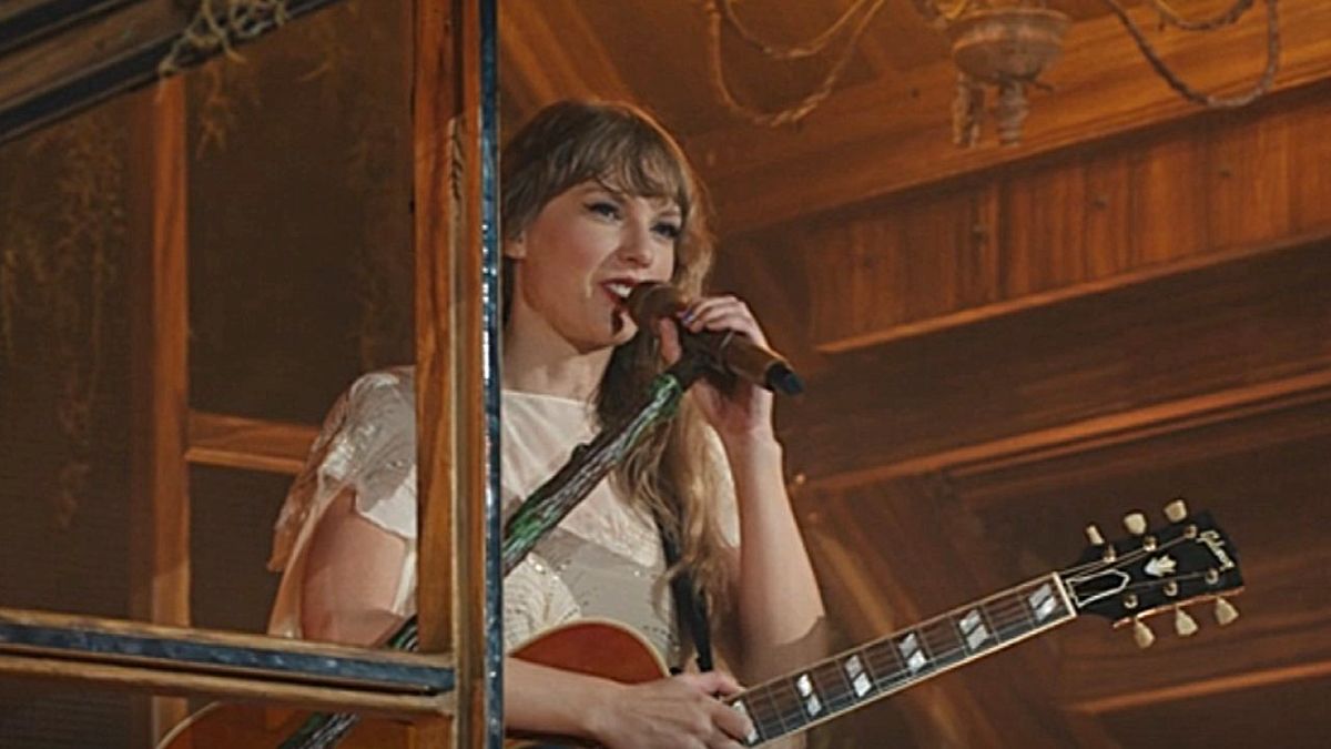 Taylor Swift talks during the Folklore era of The Eras Tour Concert movie. 