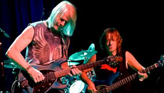 Steve Morse (left) and Dave LaRue perform onstage at the Variety Playhouse in Atlanta, Georgia on April 20, 2024