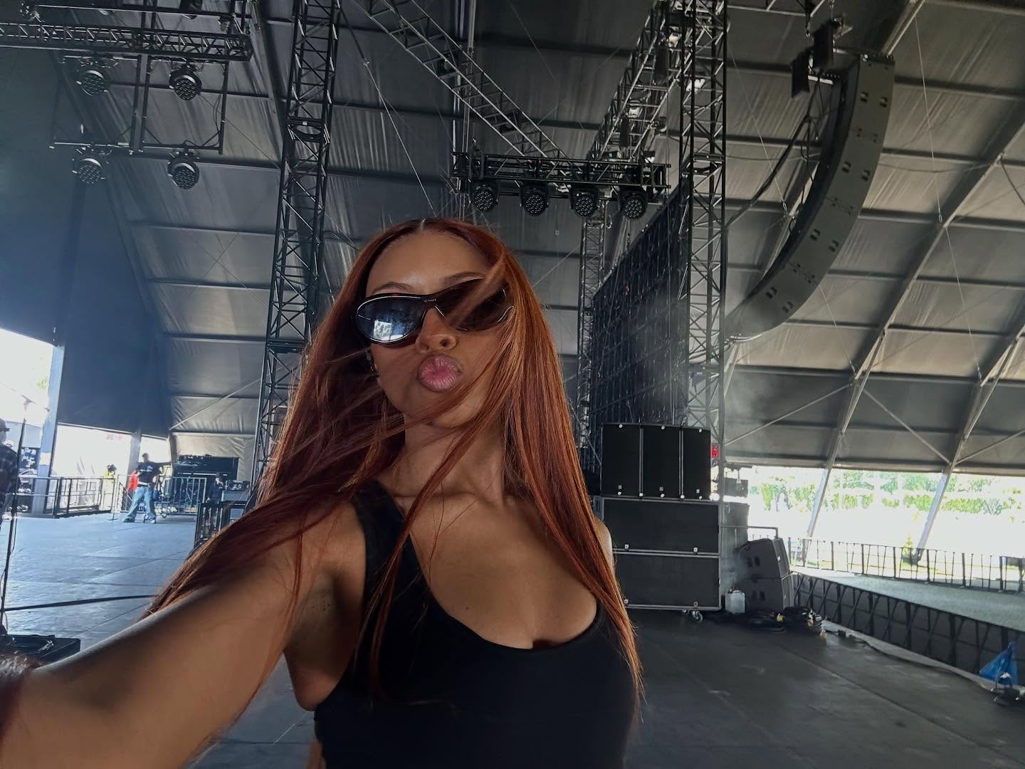 Ravyn Lenae with auburn hair