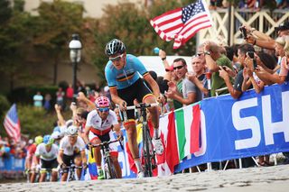 A Belgian rider races through the streets of Richmond during the 2015 UCI Road World Championships