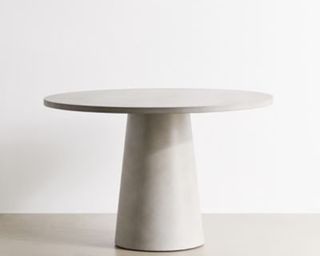A round polished concrete table by Urban Outfitters