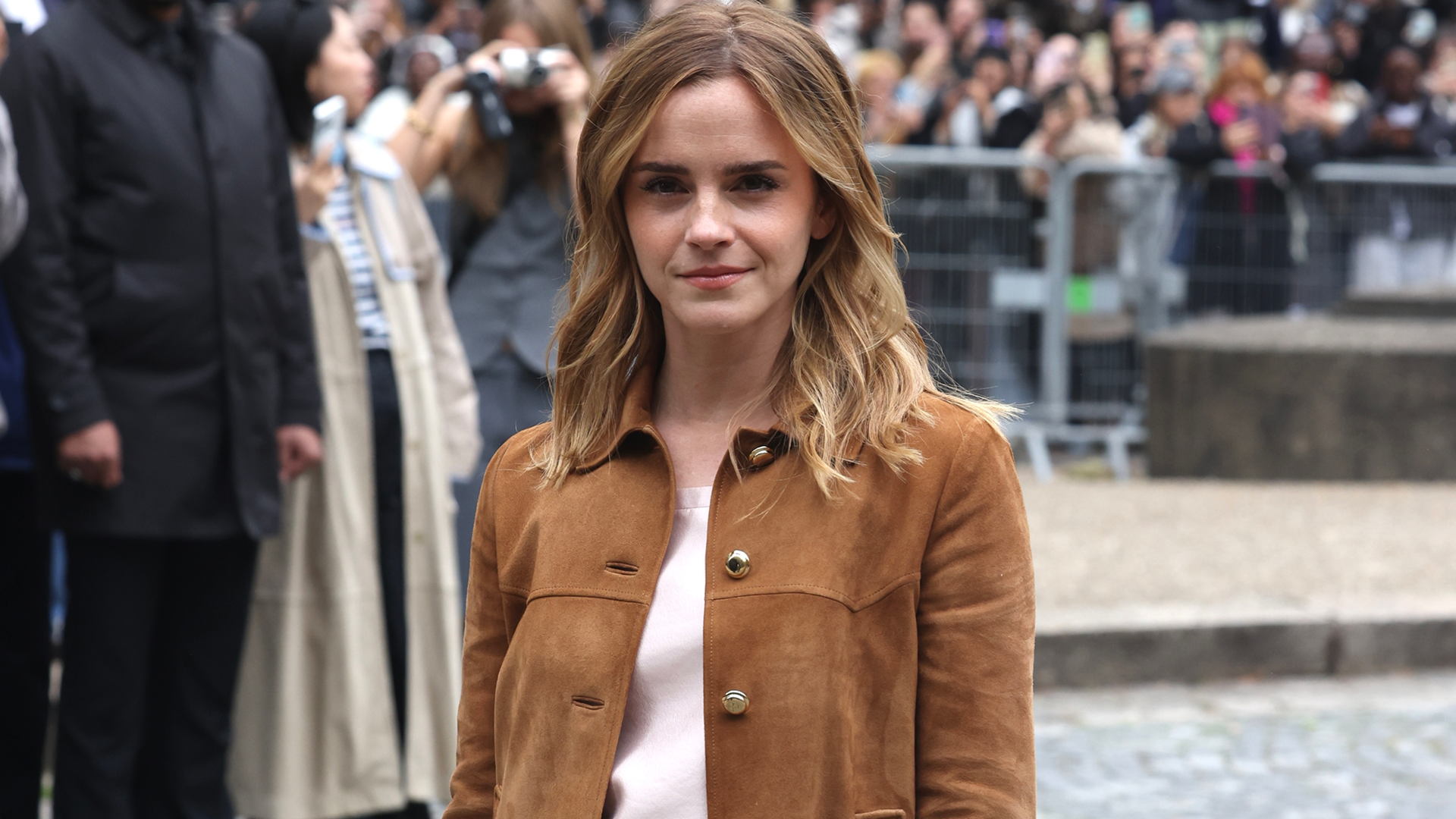 Emma Watson arrived at the Miu Miu Spring 2026 show during Paris Fashion Week wearing the fall suede jacket trend