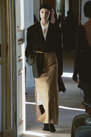 a model walks The Row winter 2025 runway during Paris Fashion Week