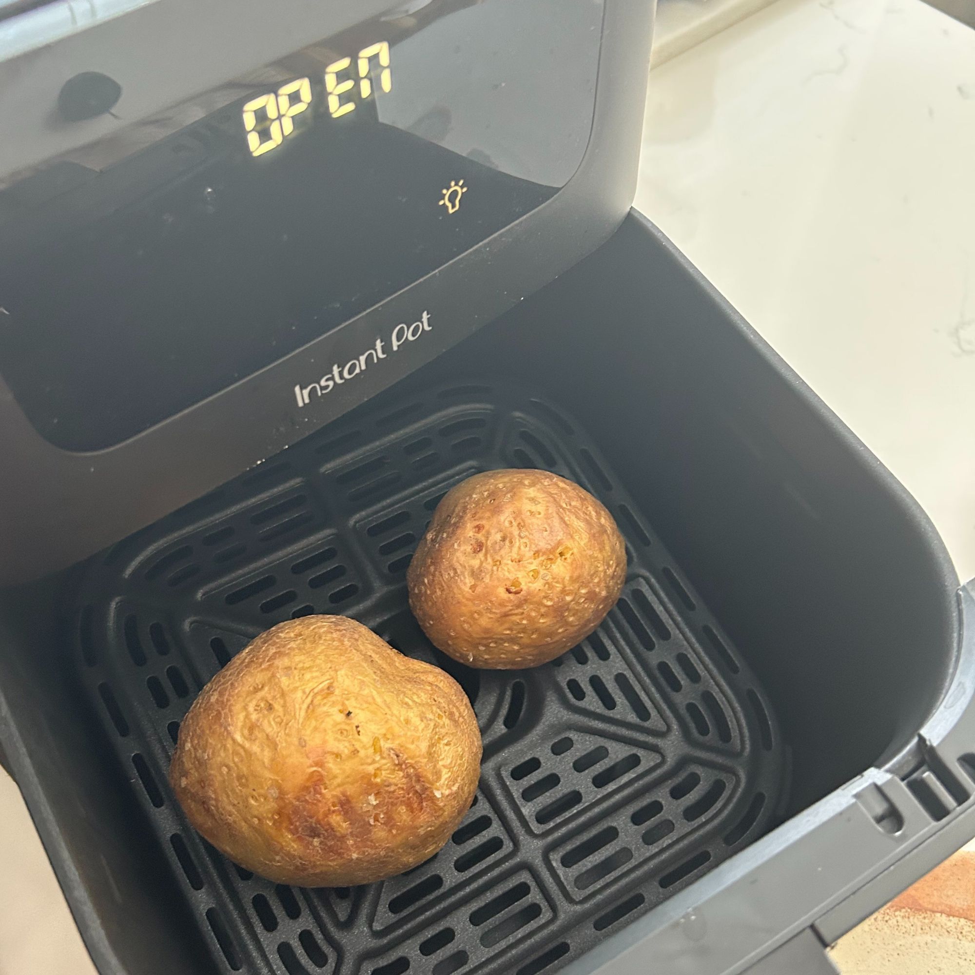 Instant Pot Vortex Compact 5L Air Fryer cooking two jacket potatoes