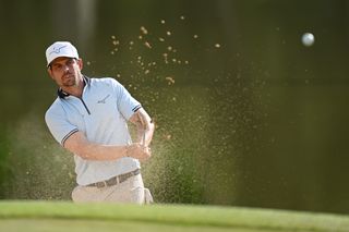 Adrien Saddier plays a pitch shot into the green