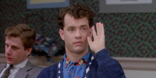 Tom Hanks raising his hand in Big