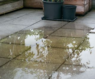 Waterlogged terrace with paving slabs