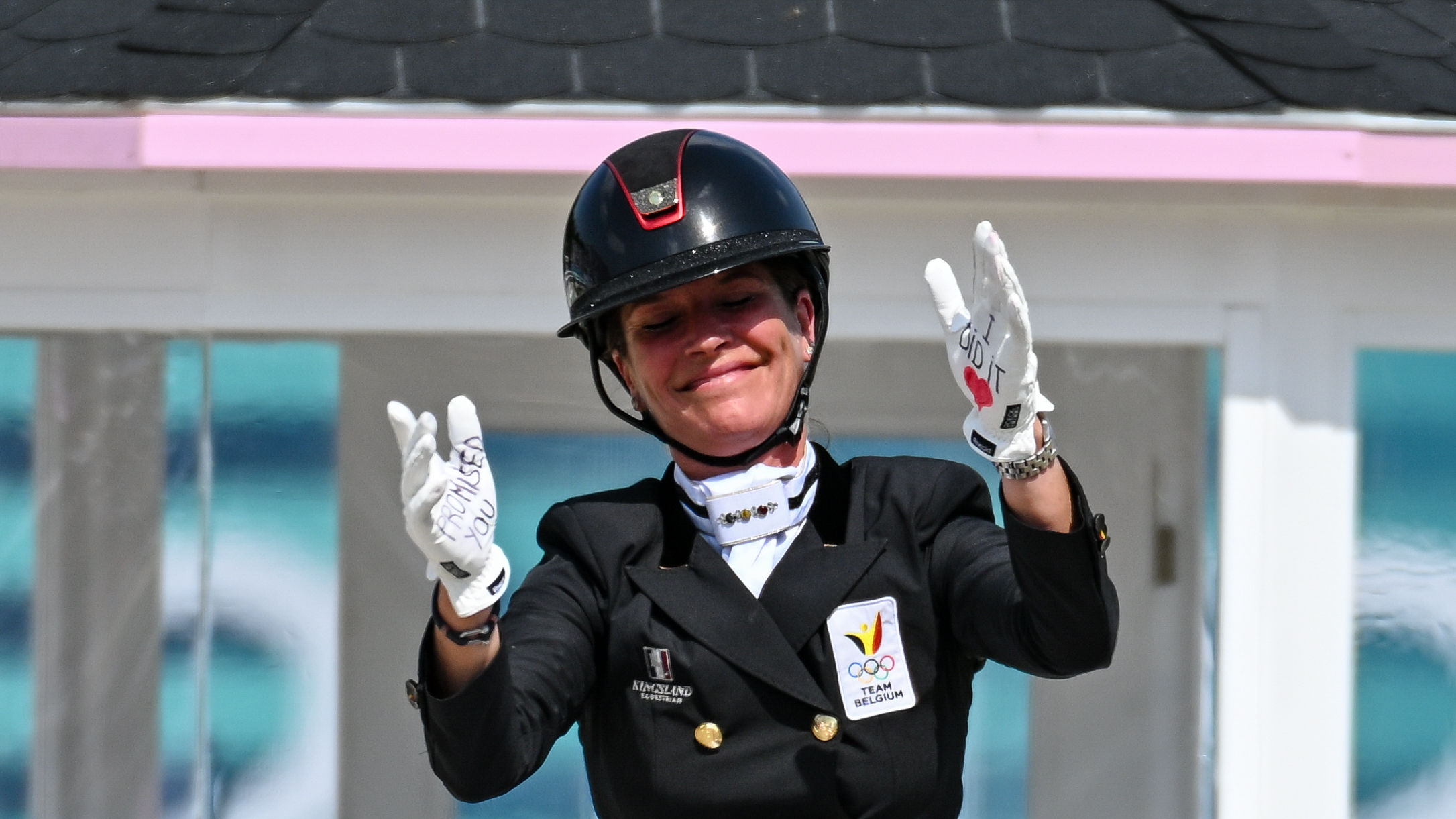 Larissa Pauluis sends her late husband a message on her hands at the Paris Olympics.