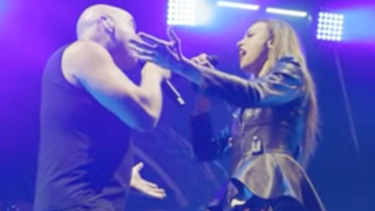 David Draiman of Disturbed and Lzzy Hale of Halestorm singing together onstage