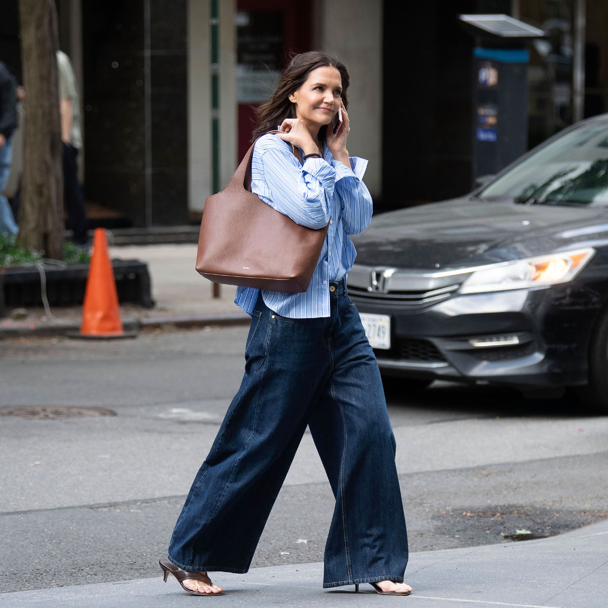 Katie Holmes wears striped shirt wide-leg jeans
