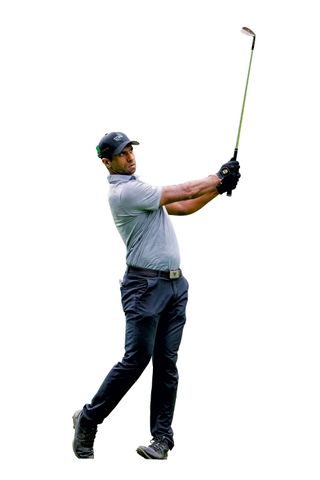 Aaron Rai in the wide follow-through position with a wedge in hand