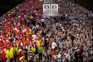 16 May 1998: Arsenal and Newcastle United fans mingle on Wembley Way before the FA Cup final at Wembley Stadium in London. Arsenal won the match 2-0. \ Mandatory Credit