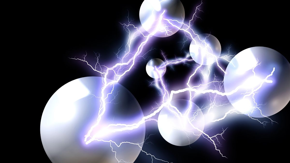 bolts of lightning spark between round objects on a black background