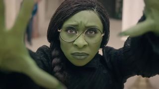 Cynthia Erivo&#039;s Elphaba holding up her hands in Wicked: Part One