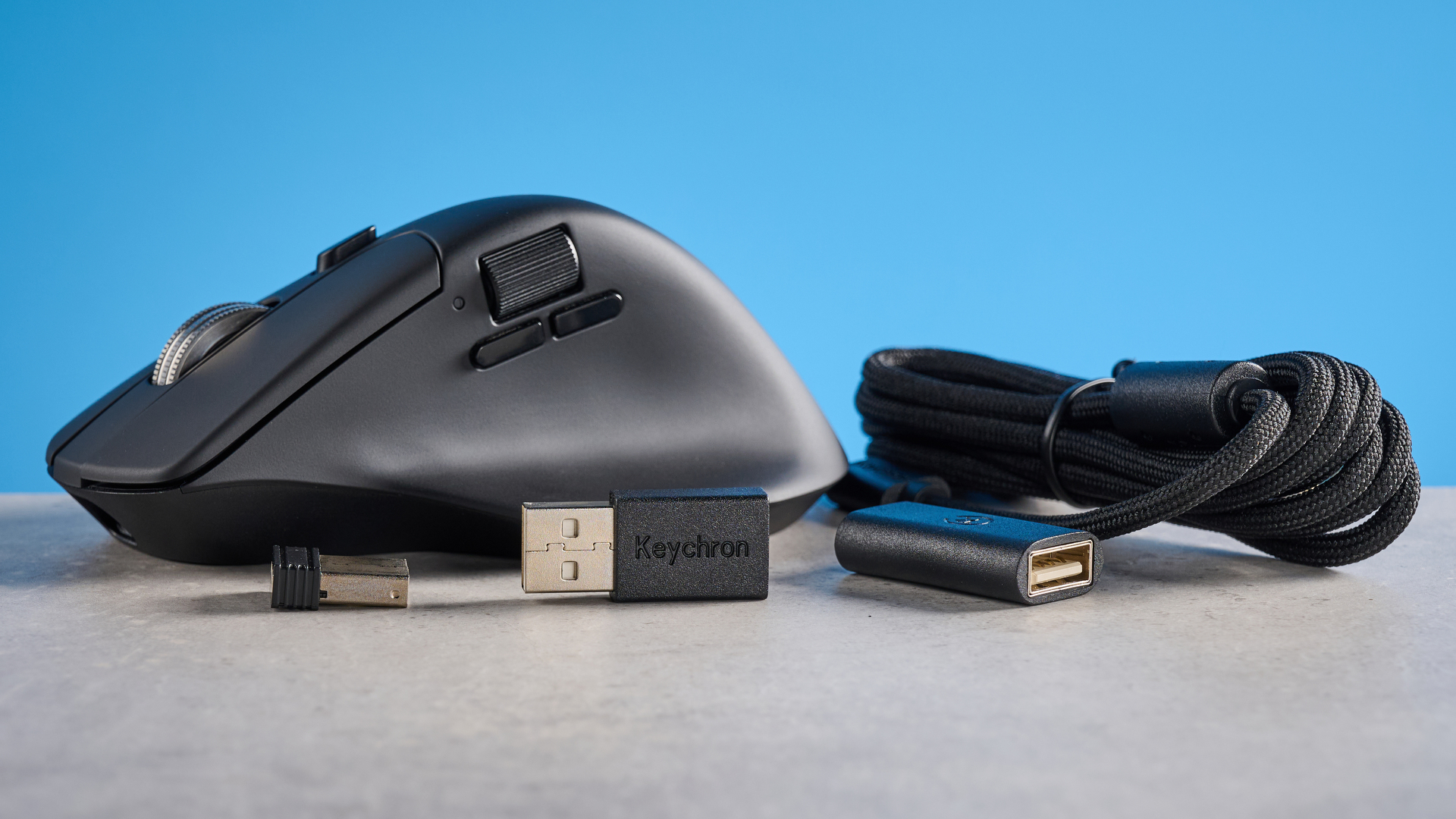 A black Keychron M6 8K ergonomic mouse