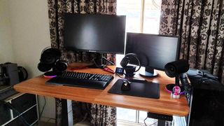 Vari Electric Standing Desk in situ with monitors and accessories