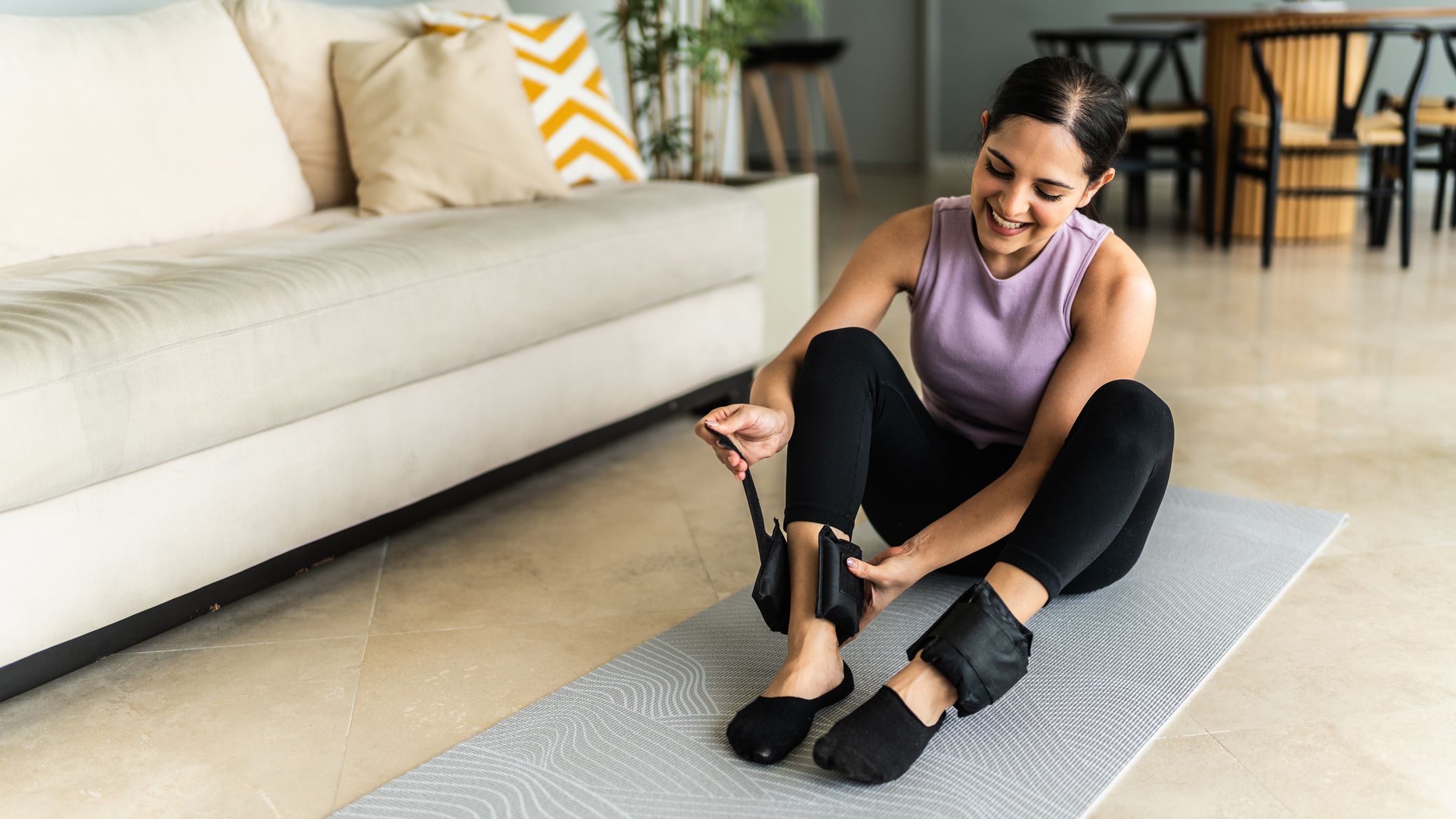 A Pilates master trainer shares her ultimate ankle weight workout to build lower-body strength