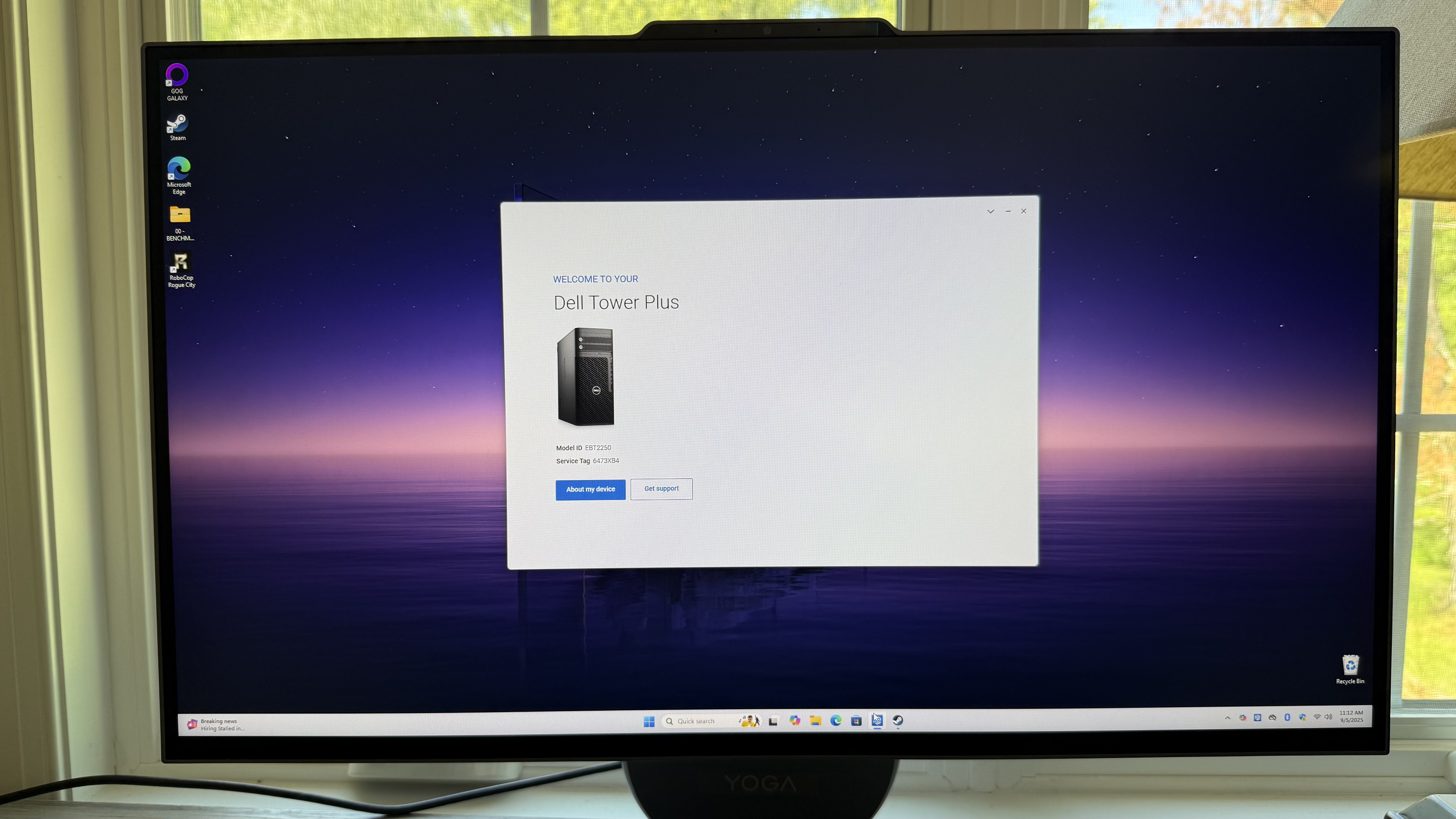 Lenovo Yoga AiO 27 another computer plugged in closeupA Lenovo Yoga AIO 27 on a desk