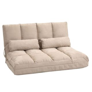 A beige colored two seater chair bed