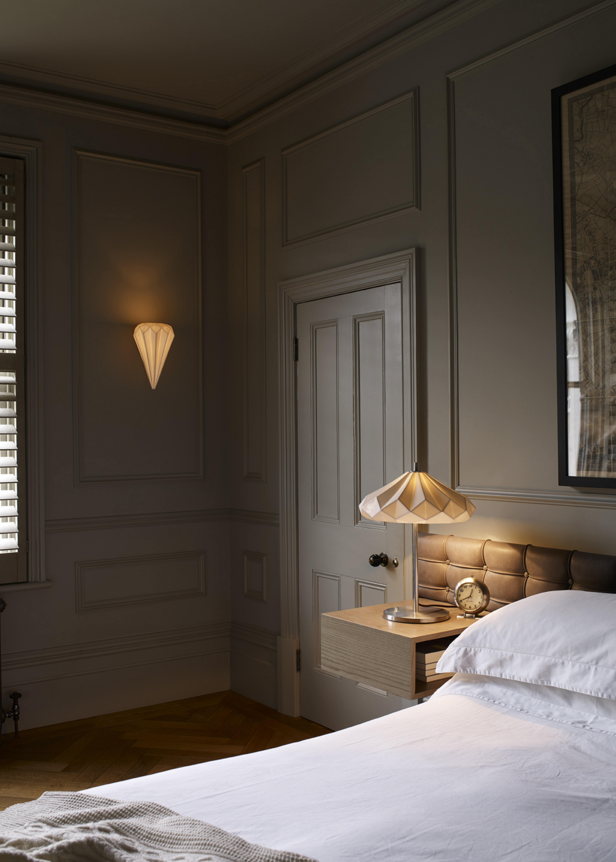 bedroom in dark grey walls and red light bulbs