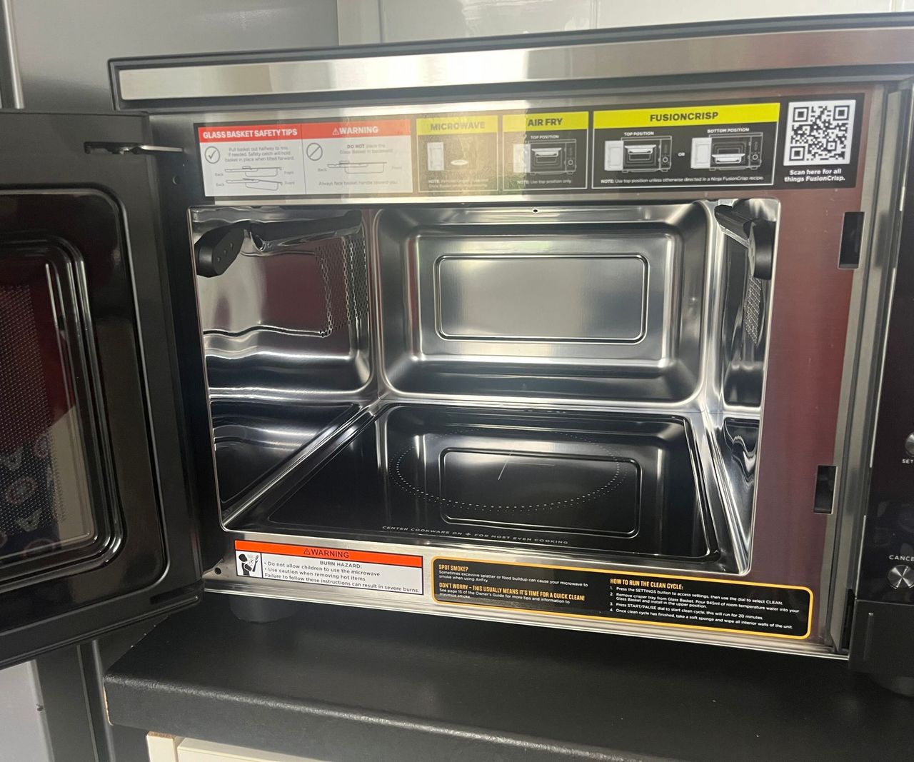 The inside of a stainless steel microwave