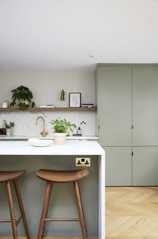 A kitchen island with plug sockets