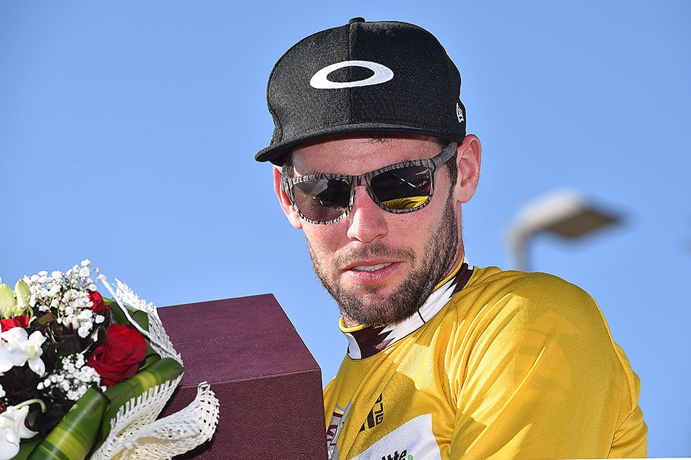 Mark Cavendish makes his way off the podium