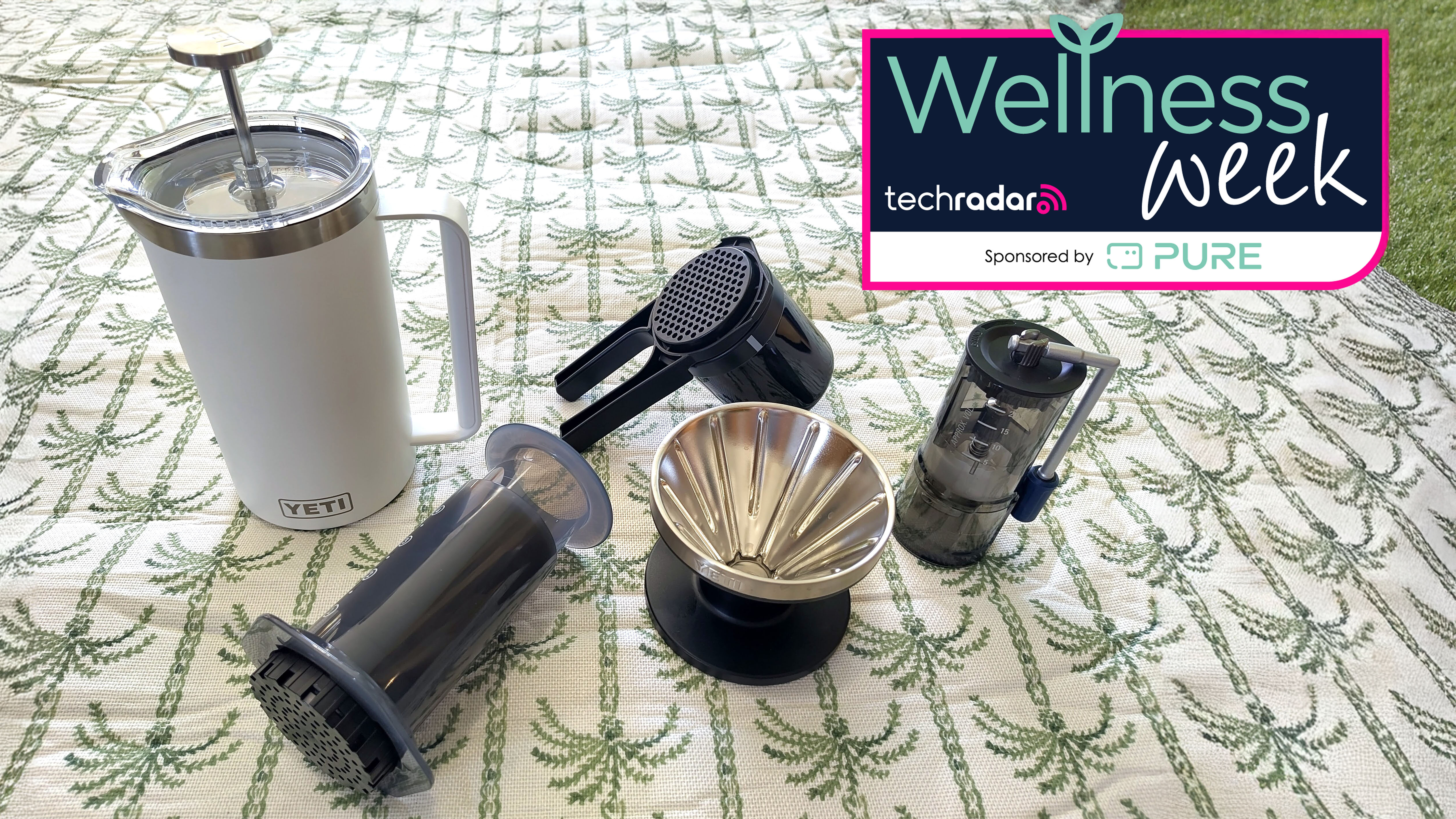 Five coffee makers on picnic blanket
