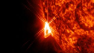 solar flare erupting from the surface of the sun.