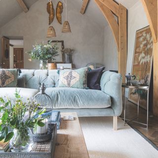 living room with pale blue velvet sofa