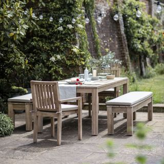Patio with wooden table and picnic style benches