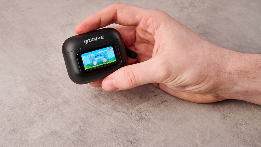 Man playing game on Groov-e Neo Buds