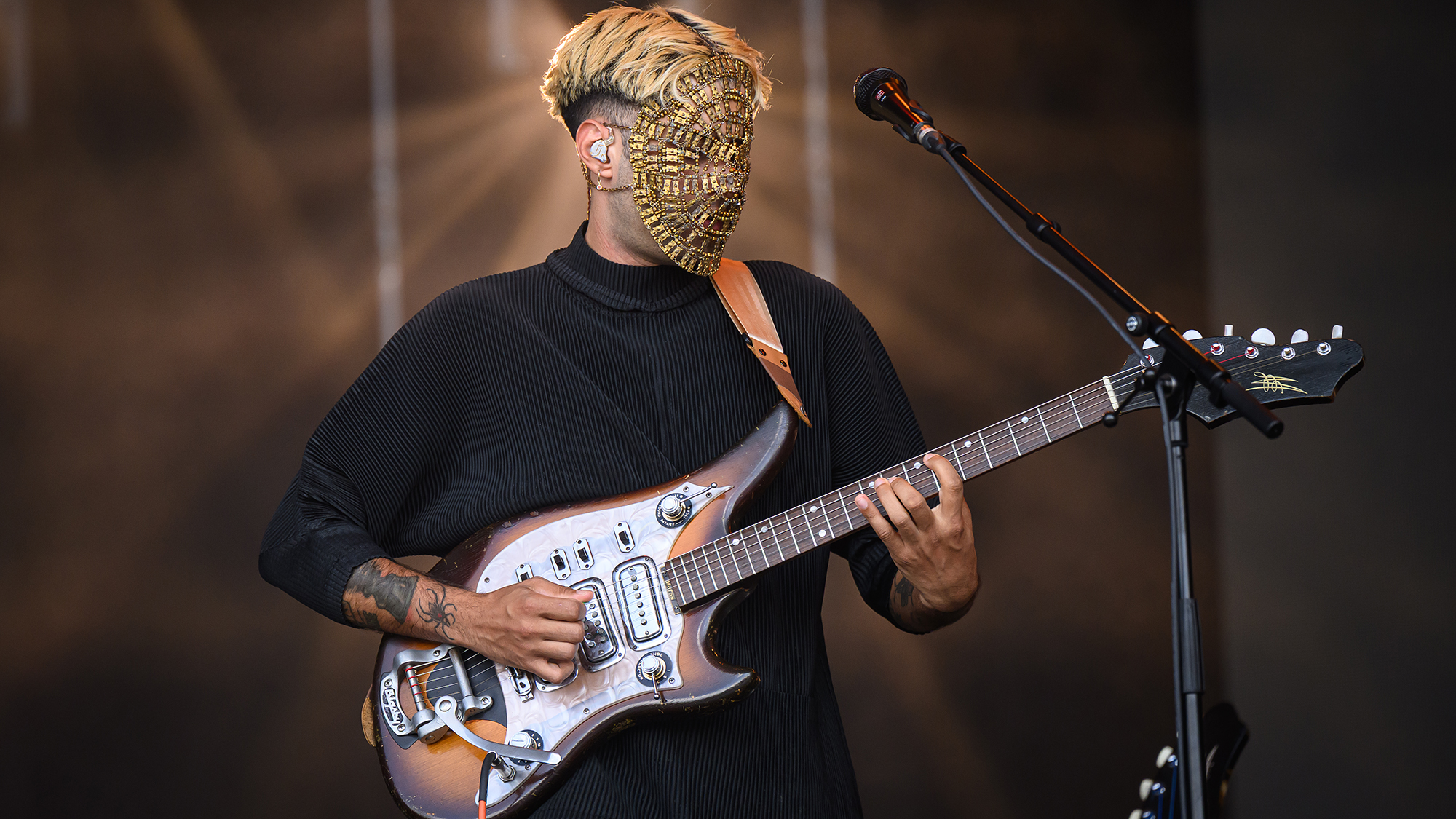 A member of Australian psychedelic group Glass Beams performs on the West Holts stage during day three of Glastonbury festival 2025 at Worthy Farm, Pilton on June 27, 2025 in Glastonbury, England.