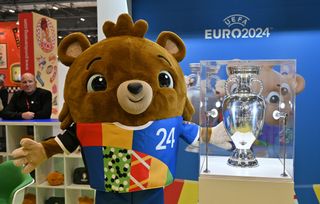  The UEFA EURO 2024 mascot Albärt character poses with the European Football Championship trophy during the Brand Licensing Europe at ExCel on October 04, 2023 in London, England. Brand Licensing Europe (BLE) event is dedicated to licensing and brand extension, bringing together retailers, licensees and manufacturers for three days of deal-making, networking and trend spotting. (Photo by John Keeble/Getty Images)