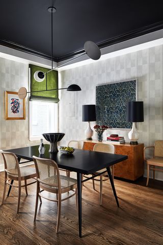 Dining room with black painted ceiling