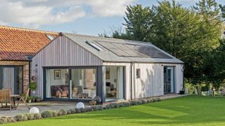 vertical timber clad extension to barn conversion