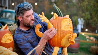 Promo image of a man carving a pumpkin in Outrageous Pumpkins