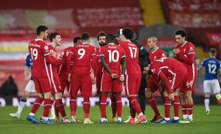 Liverpool players talk in a huddle