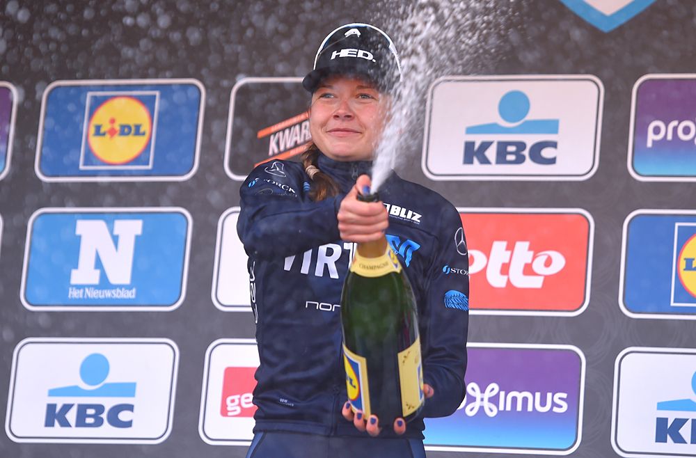 Christine Siggaard celebrates her win at Omloop Het Nieuwsblad