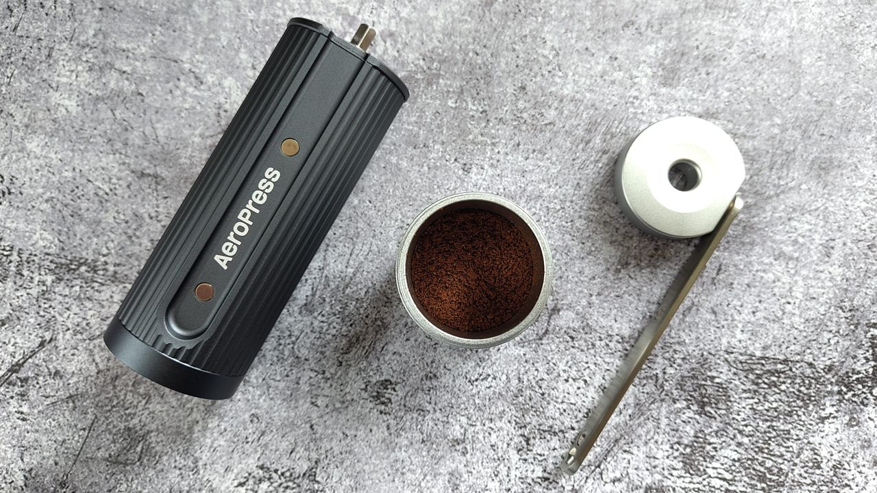 Aeropress manual coffee grinder with freshly-ground coffee