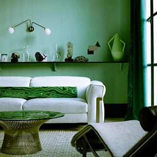 living room with sofa and shade of green paint