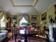 Fig 2: The drawing room, with its reconstructed Regency fireplace and coved plaster ceiling, created out of the former schoolroom. Church Cottage, Humbleton, South Yorkshire. Photographed by Paul Highnam for Country Life. ©Country Life